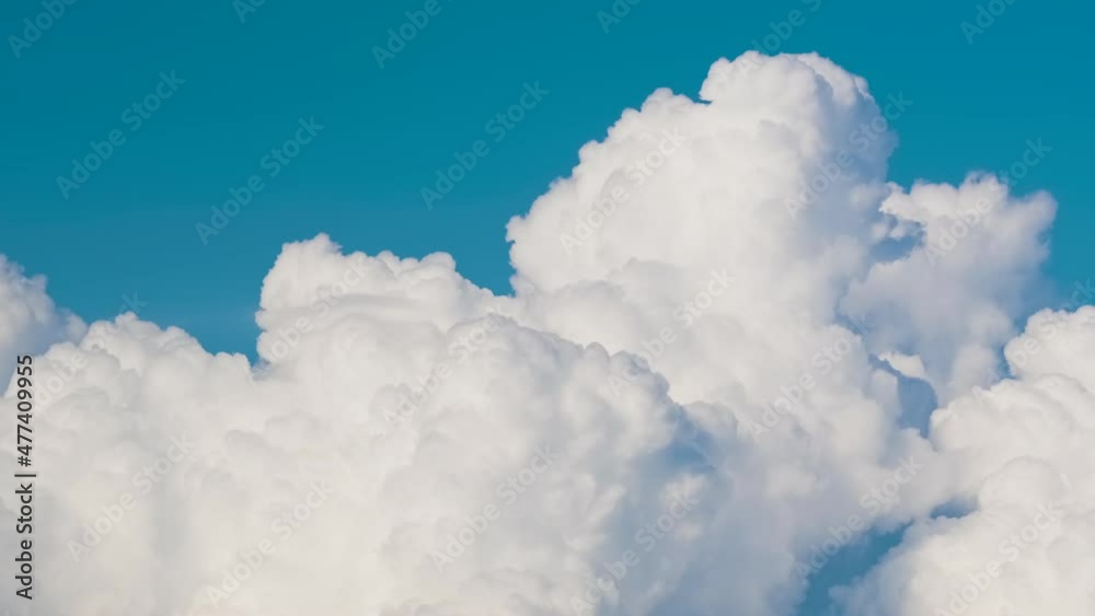 Timelapse of white puffy cumulus clouds forming on summer blue sky. Moving and changing cloudscape weather Timelapse of white puffy cumulus clouds forming on summer blue sky. Moving and changing cloudscape weather