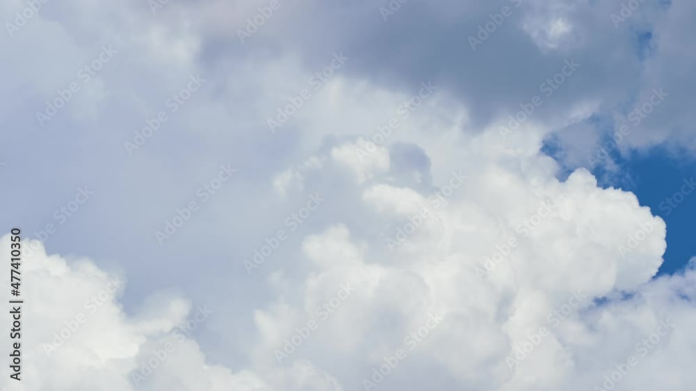 Timelapse of white puffy cumulus clouds forming on summer blue sky. Moving and changing cloudscape weather Timelapse of white puffy cumulus clouds forming on summer blue sky. Moving and changing cloudscape weather