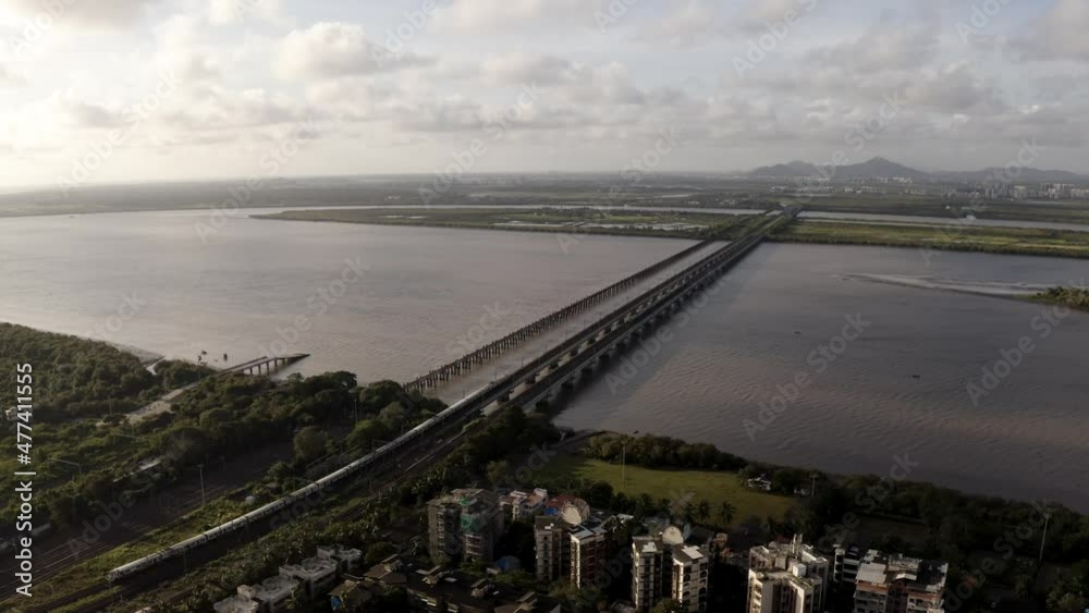 Vasai Railway Bridge - Suburban Train Crossing Railway Bridge Over Vasai Creek In Mumbai, Maharashtra, India. - aerial Vasai Railway Bridge - Suburban Train Crossing Railway Bridge Over Vasai Creek In Mumbai, Maharashtra, India. - aerial