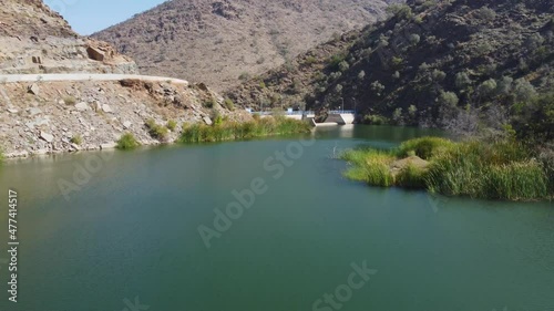 Aerial drone view over the Wadi dark dam, in Al Baha, sunny Saudi Arabia photo