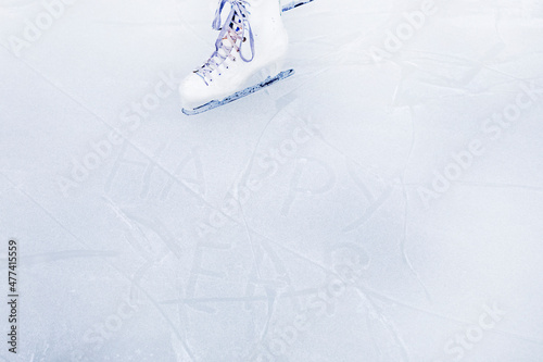 happy new year on ice with prints from figure skates with ice skates horizontal