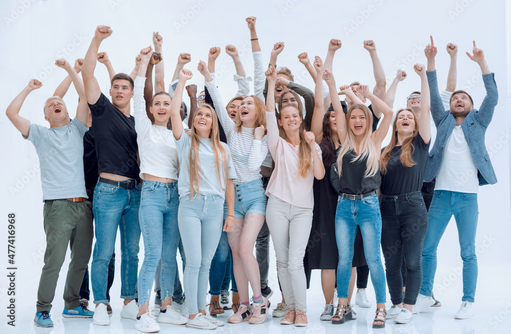 Fototapeta premium happy group of young people with hands up