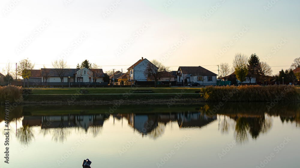 Lakeside houses in the autumn sunlight
