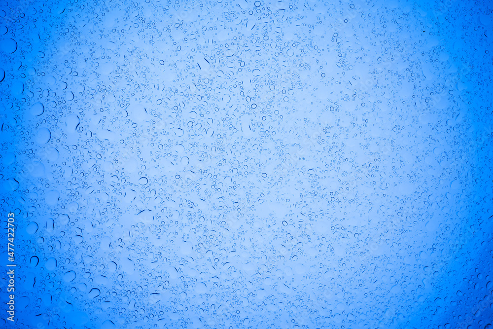 Rain droplets on blue glass background, Water drops on blue glass. Rain droplets on blue glass background, Water drops on blue glass.