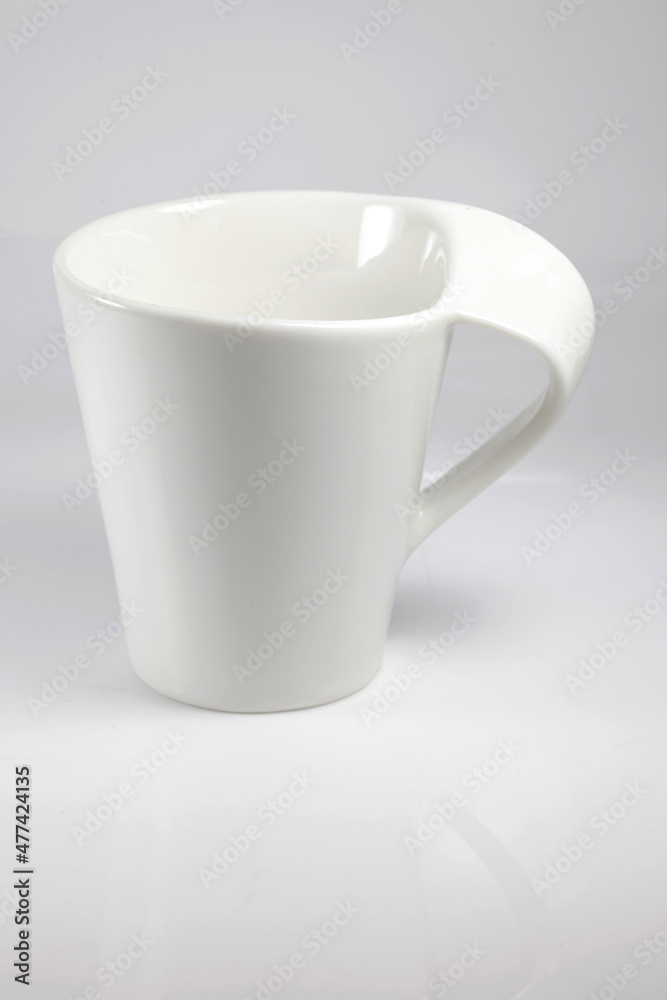 Obraz premium White cup on white background.