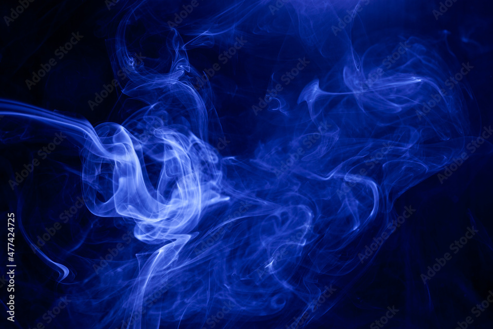 Blue smoke on a black background.