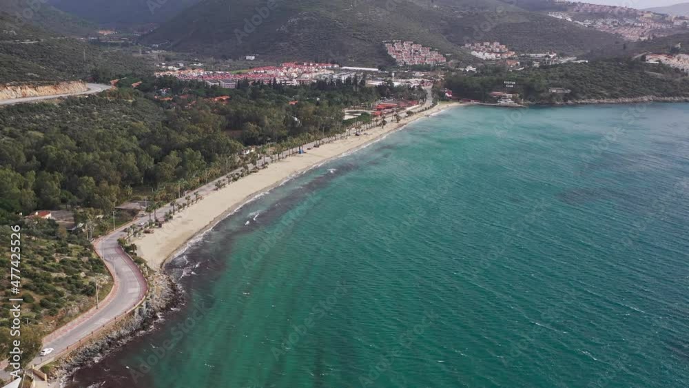 Silver Beach in Kusadasi with tourist resorts, hotels and blue-green turquoise seawater Silver Beach in Kusadasi with tourist resorts, hotels and blue-green turquoise seawater