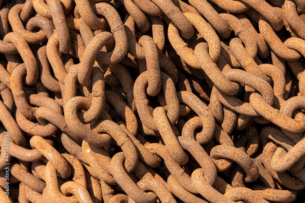Construction chain. Rusty chains background. Chain used for lifting loads on a construction site Construction chain. Rusty chains background. Chain used for lifting loads on a construction site