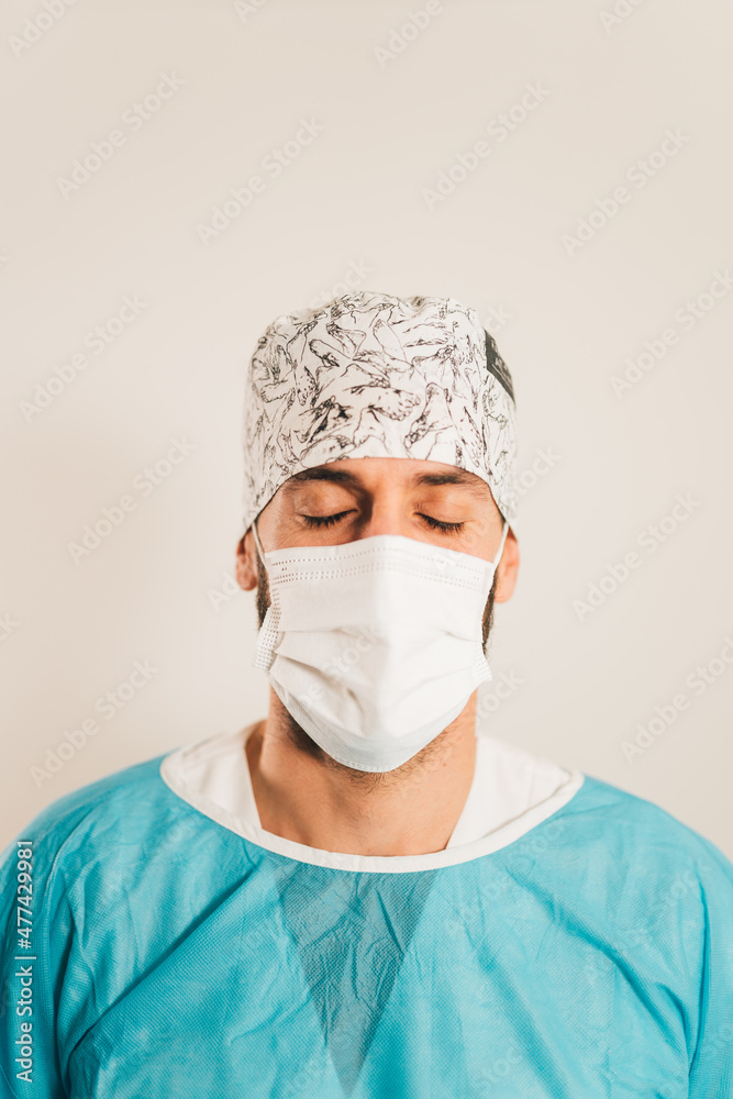 Chiropodist surgeon relaxed and taking deep breaths before surgery Chiropodist surgeon relaxed and taking deep breaths before surgery