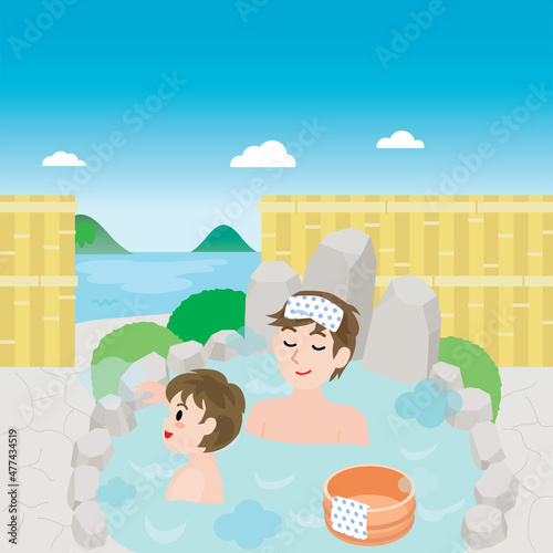 海の見える露天風呂に入る親子