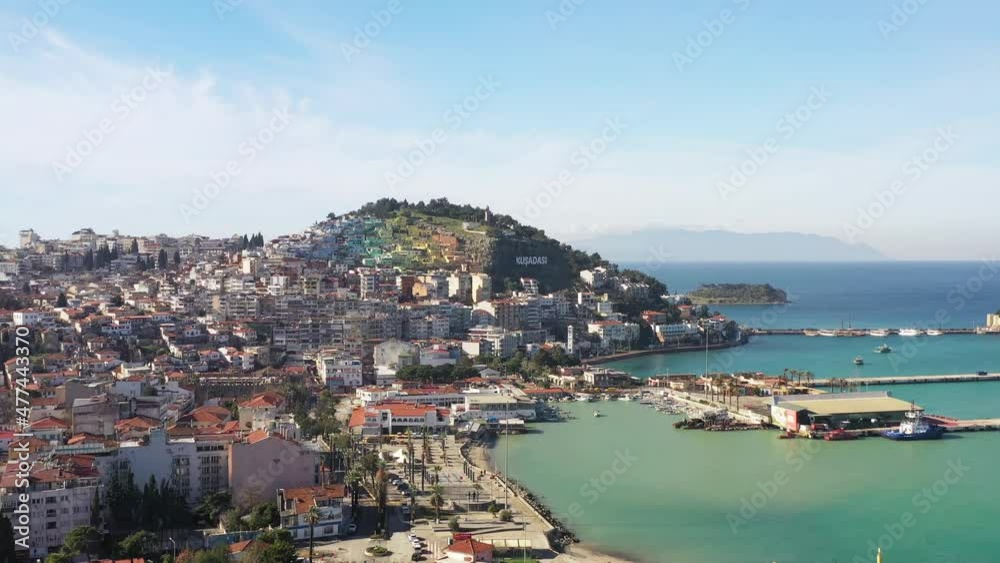 Aerial view of the city of Kusadasi with the hill and skyline with mediterranean sea Aerial view of the city of Kusadasi with the hill and skyline with mediterranean sea