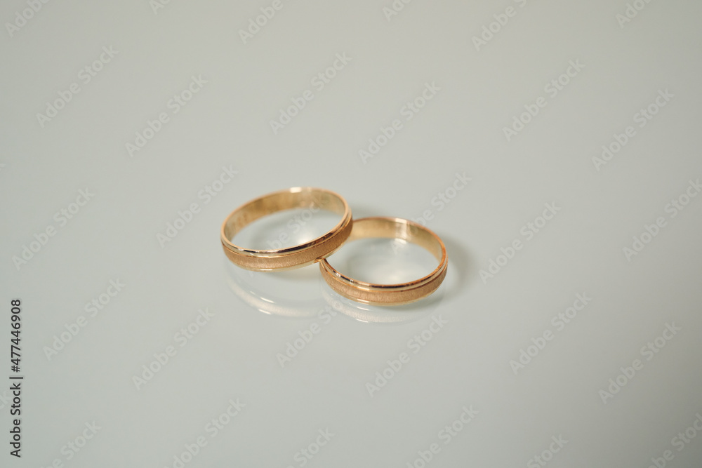 Two matching traditional gold wedding or engagement rings Two matching traditional gold wedding or engagement rings