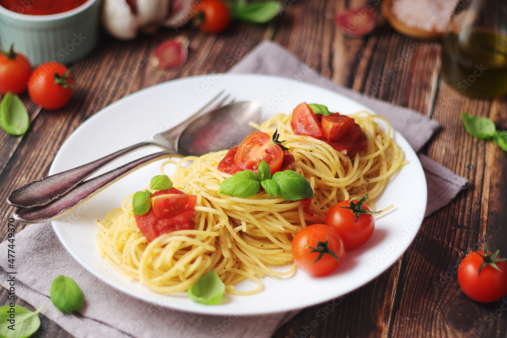 Italian pasta spaghetti with basil and cherry tomatoes Italian pasta spaghetti with basil and cherry tomatoes