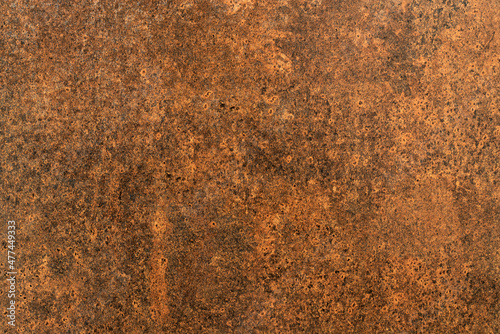 Horizontal view of the pockmarked marble texture for pattern and background. Brown color