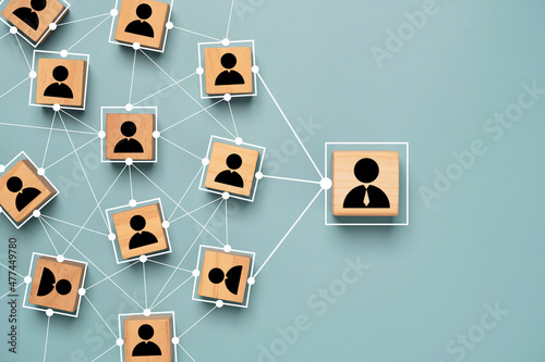 Manager and staff icon print screen on wooden cube block with connection link network for organisation structure in company  social network and teamwork concept. photo