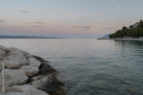Landscape of Adriatic sea and croatian coast near tourist resort Baska voda at down in summer photo