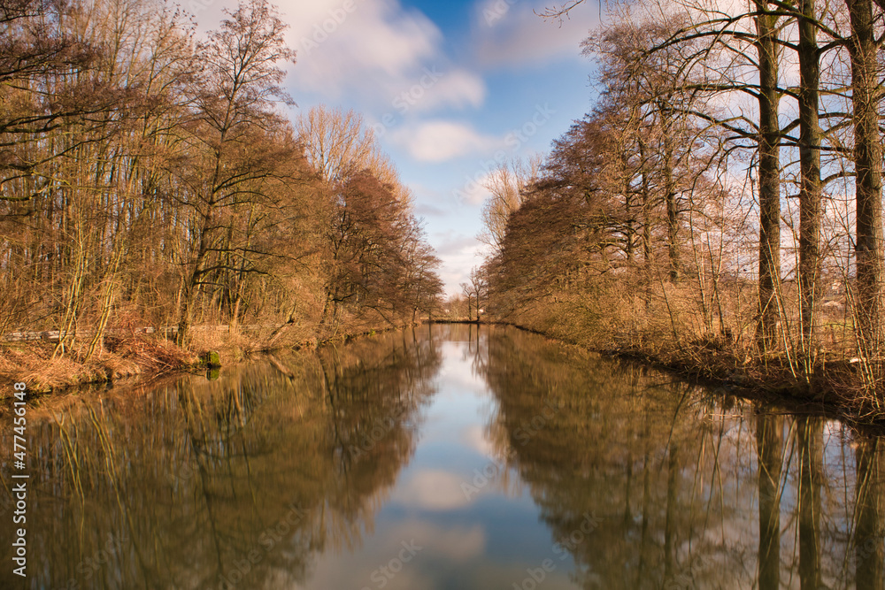 calm river lined with trees