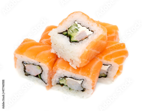 Sushi with salmon and cucumber on a white plate.