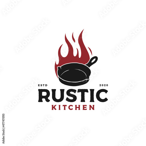 Vintage retro rustic old skillet cast iron with fire, classic restaurant kitchen logo