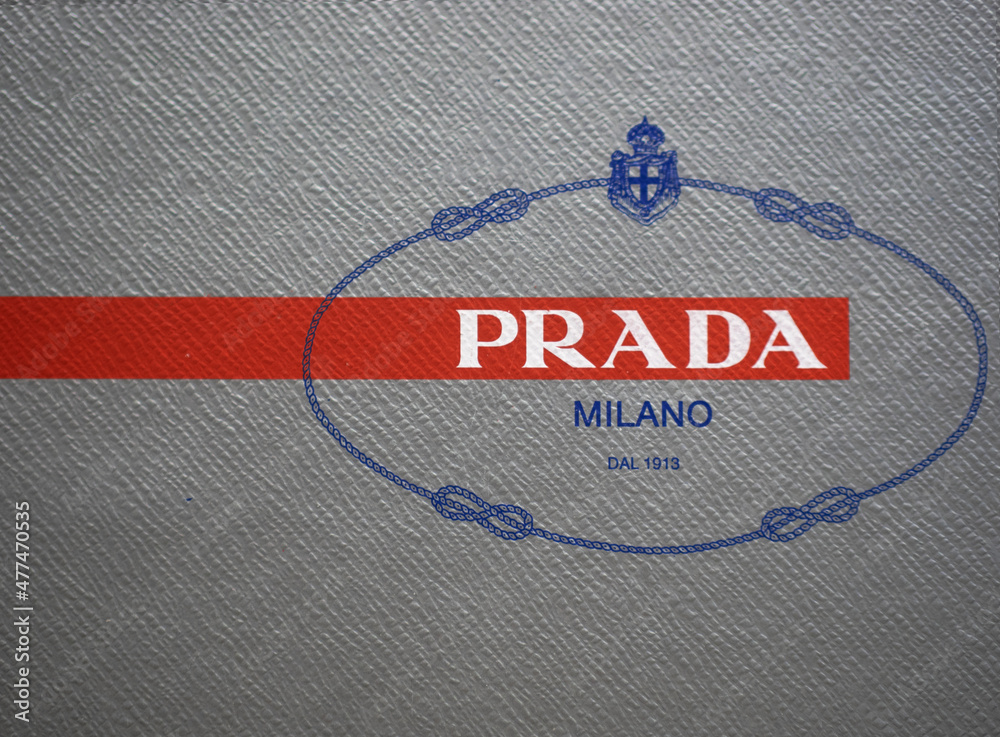 Logo Prada on grey background and red strip.Prada is a fashion house  founded in 1913 in Milan, Italy.December 29th 2021 Stock Photo | Adobe Stock
