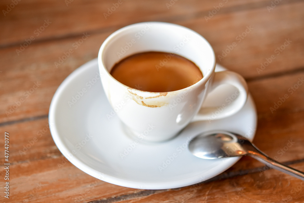 Close-up view, Stains of coffee cup after drinking with spoon.