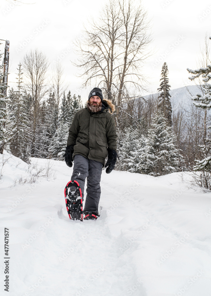 Man Snowshoeing in the Forest 
