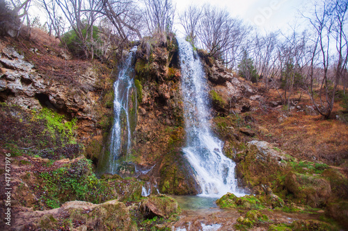 Beautiful forest waterfall  autumn day. Gostilje waterfall at mountain Zlatibor  Serbia.