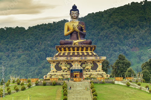 Beautiful huge statue of Lord Buddha, at Rabangla , Sikkim , India. Surrounded by Himalayan Mountains it is called Buddha Park - a popular tourist attraction. photo