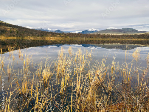 panoramic view of mountain and lake in the fall. hiking and relaxation concept.