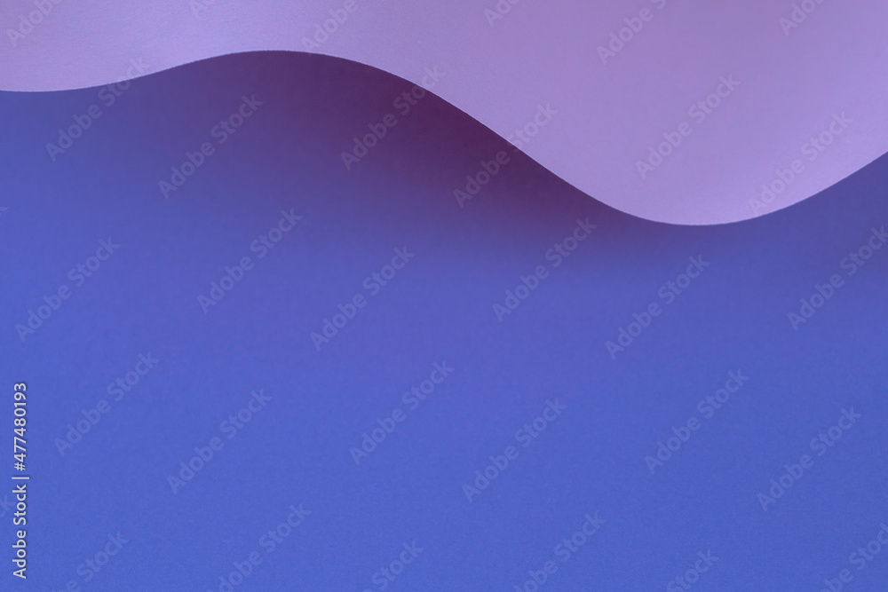 Abstract wave of pastel blue, purple, very peri color paper. Creative geometric curved paper with light and shadows. Abstract geometry vertical background with copy space Abstract wave of pastel blue, purple, very peri color paper. Creative geometric curved paper with light and shadows. Abstract geometry vertical background with copy space
