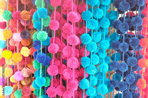 Strands of colorful pom poms. Todos Santos, Mexico photo