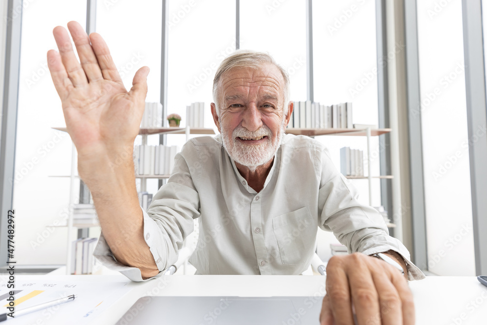 Fototapeta premium senior man typing keyboard on laptop computer and say hello or goodbye with someone from chat online