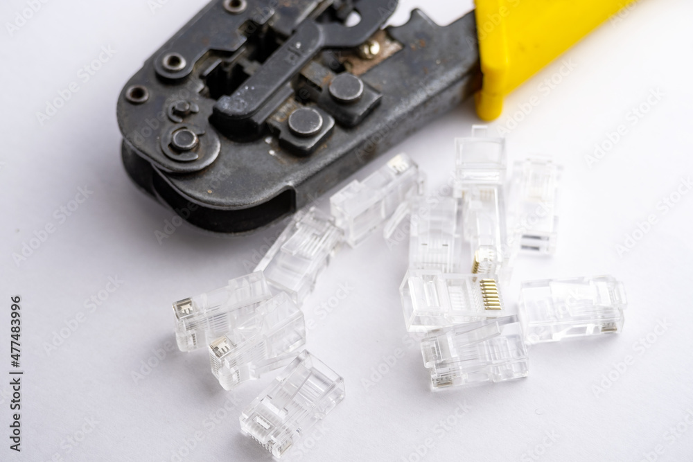 Modular plug crimpers for RJ-45, white background, Crimper, Twisting Cable Tool for Crimping RJ 45 LAN cable Modular plug crimpers for RJ-45, white background, Crimper, Twisting Cable Tool for Crimping RJ 45 LAN cable