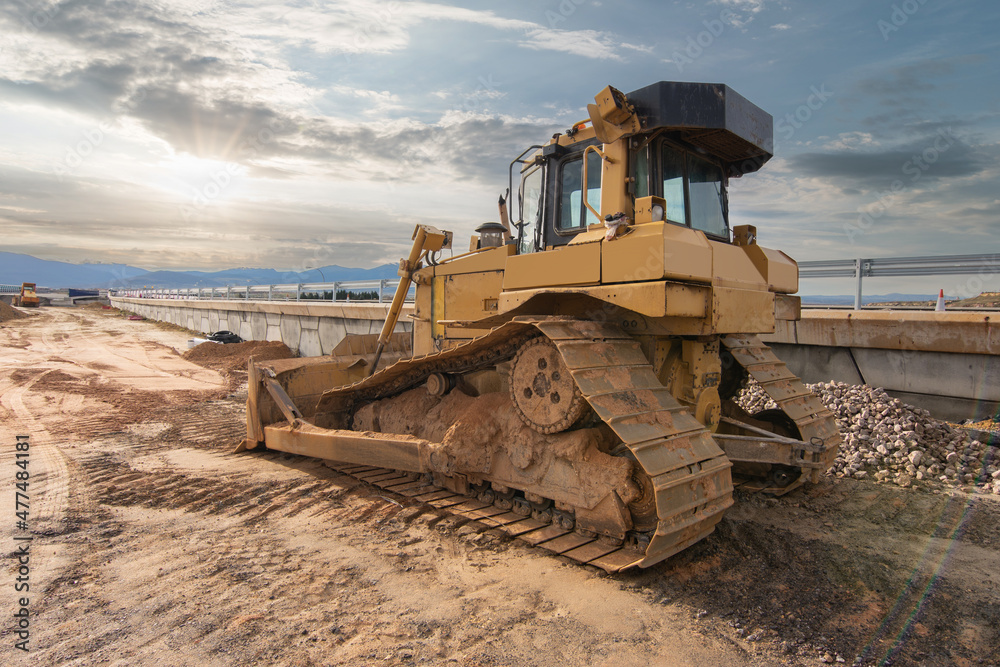 Excavator at a construction site, performing earth moving work