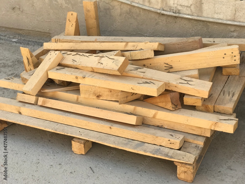 Cut pieces of wood used for shuttering and stacked at site used nails which are near miss Cut pieces of wood used for shuttering and stacked at site used nails which are near miss