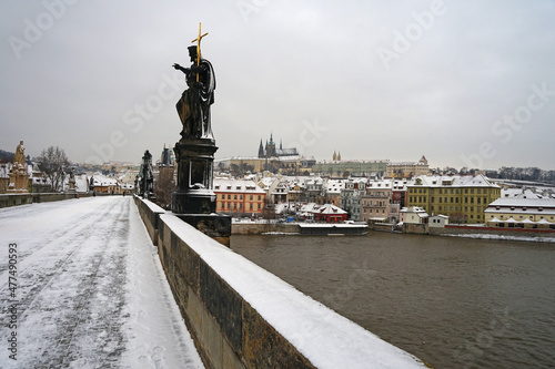 Photography Historic stone Charles Bridge with statuescovered with snow in winter season, Pr