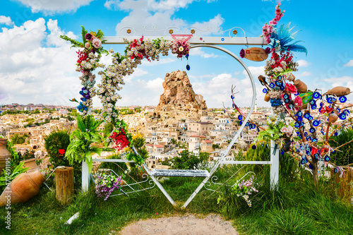 Kapadokya swings empty on viewpoint to Ortahisar castle with beautiful spring flower decorations