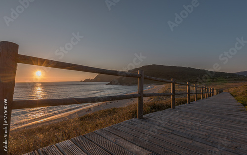 Last view of the sun at Finisterre Beach, endpoint of the Camino de Santiago photo