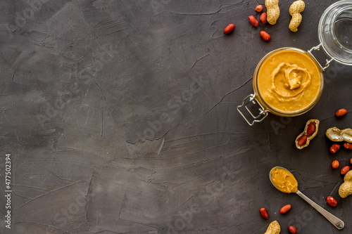 Homemade creamy peanut butter with nuts, top view