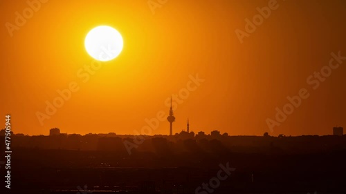 Timelapse of the Sun going behind Torrespaña also known as Pirulí an iconic building in Madrid photo