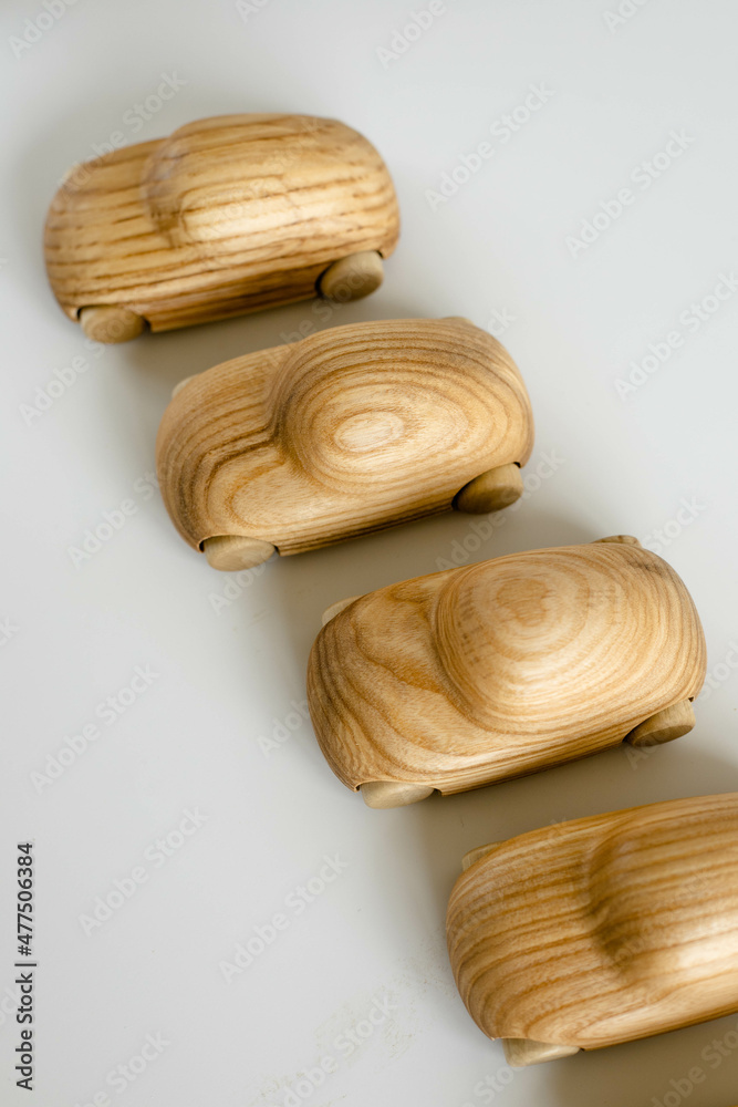 Set of wooden eco toy car for toddlers on minimalistic background. Educational game for preschool. Topview