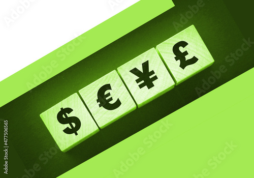 Dillar, euro, yen and pound on building blocks. wooden cubes with different money signs, Cuurency, money, international business concept photo