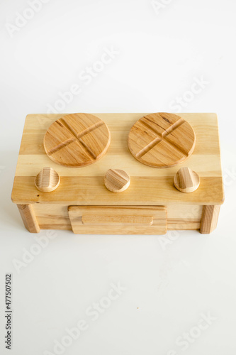 Wooden eco toy stove in details. Educational toys on white background. Good game for each child