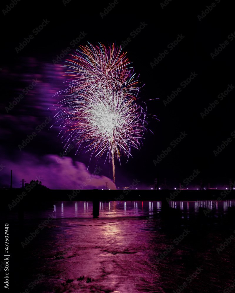 Independence Day fireworks over water with bridge in Danville,VA Independence Day fireworks over water with bridge in Danville,VA