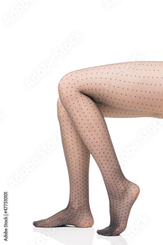 Close-up view of sexy legs in transparent tights