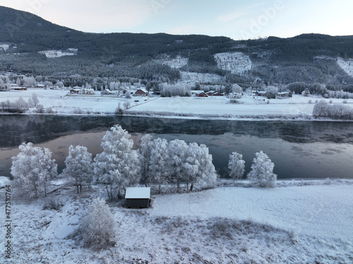 Drone photo fra Hallingdal, Nesbyem. The river is freezing but it is warmer than the air. Frost smoke.  photo