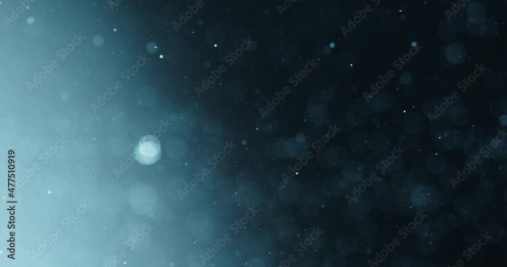 Bubbles Rising In Water Against Blue Background