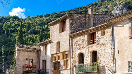 Saint-Guilhem-le-Desert in France, view of the village, typical houses, with the mountain in background  © Pascale Gueret