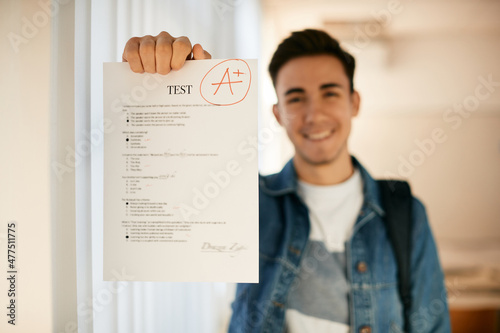 Close-up of student gets A+ grade on test in high school. photo