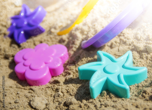 Multi-colored plastic toys for children to play in the sand on the beach and in the sandbox.